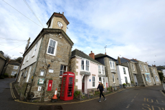 A red phone box adorns the village of Mousehole a fishing village in Cornwall, England. (Photograph by Kim Newton)