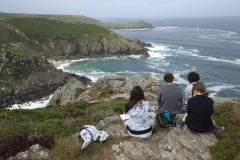 Hikers stop to enjoy the view along the coastal path near Zennor, Cornwall, England. (Photograph by Kim Newton0