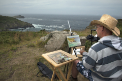 A landscape painter paints a scene along the coastal path near Zennor, Cornwall, England. (Photograph by Kim Newton)