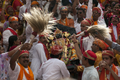The black stone image of Vishnu as Jagannath, Loard of the Universe is carrieddown the steps of the Jagdish Temple during a festival in Udaipur, India.