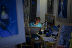 An artist paints in his studio in Orvieto, Italy.