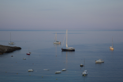 Sunrise over yachts anchored in Saint Elm harbor, Mallorca, Spain.