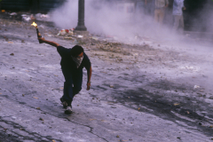 A South Korean protestor prepares to throw a Molotov cocktail at riot police during demonstrations for constitutional reform in the Myeongdong district of Seoul, South Korea. The protests led to democratic elections, the release of political prisoners and the lifting of a ban on dissidents participating in the political process. (Photograph by Kim Newton)
