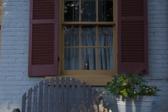 Early morning light and a candle in the window lightup the a home in Saint Genevieve, Missouri. The French Colonial town is a popular destination for tourists along the Mississippi River.