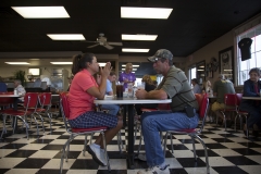 A couple wait to order breakfast at a restaurant off Interstate 40 on the Oklahoma side of the border with Arkansas.